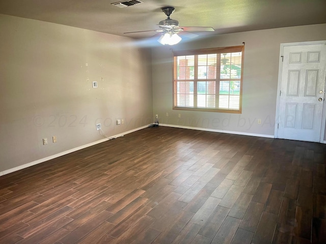 empty room featuring dark hardwood / wood-style floors and ceiling fan