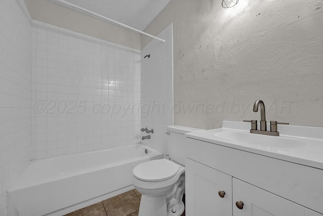 full bathroom with vanity, tiled shower / bath, tile patterned floors, and toilet