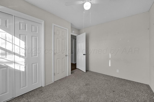 unfurnished bedroom with carpet floors and ceiling fan