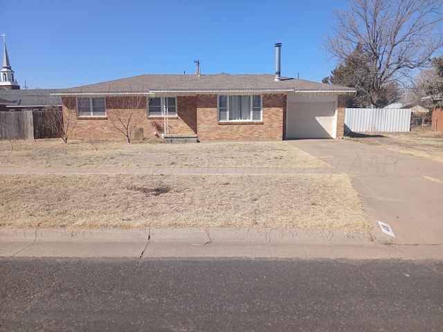 ranch-style house featuring fence, a shingled roof, concrete driveway, a garage, and brick siding