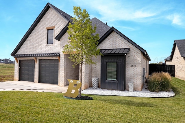 4410 N Rocking Chair Ln, Amarillo, TX 79124 - view of front of house featuring brick siding, a standing seam roof, concrete driveway, a front lawn, and a metal roof