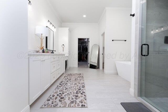 4410 N Rocking Chair Ln, Amarillo, TX 79124 - bathroom with double vanity, a stall shower, a spacious closet, a freestanding bath, and crown molding