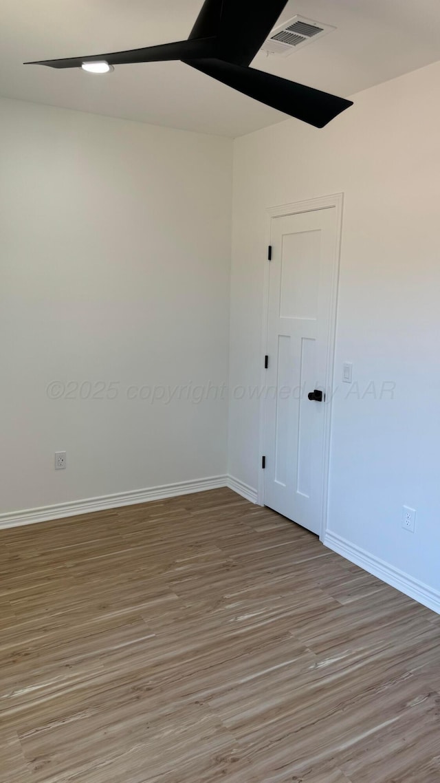 unfurnished room featuring light wood-type flooring