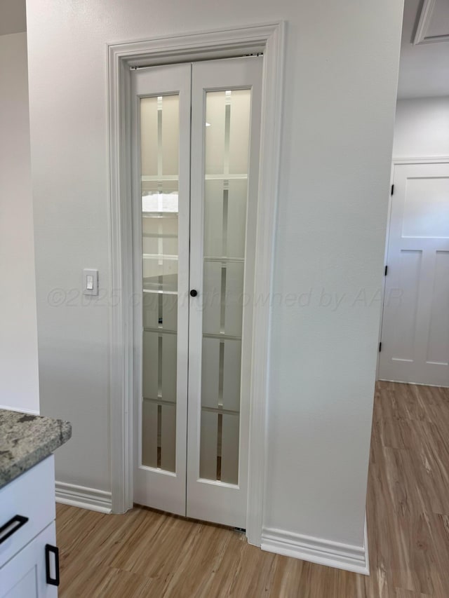 doorway featuring french doors and light wood-type flooring