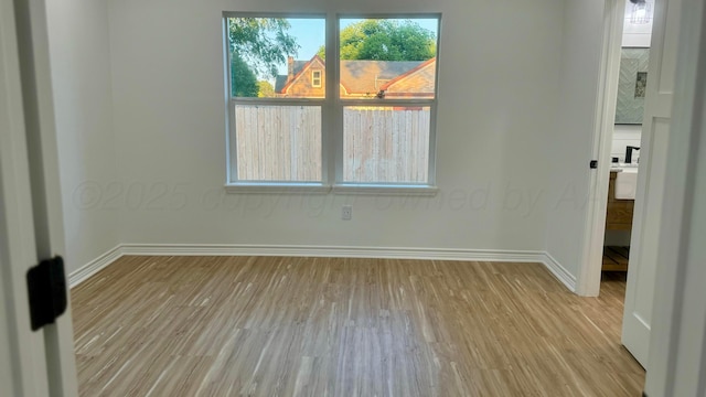 spare room with light wood-type flooring