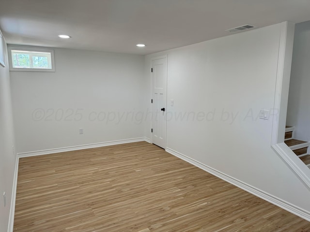 unfurnished room with light hardwood / wood-style flooring