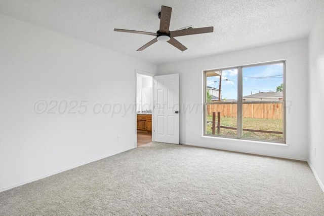 1132 Sterling Dr, Amarillo, TX 79110 - empty room featuring carpet floors, ceiling fan, baseboards, and a textured ceiling
