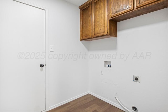 1132 Sterling Dr, Amarillo, TX 79110 - laundry room featuring cabinet space, hookup for a washing machine, dark wood-type flooring, electric dryer hookup, and baseboards
