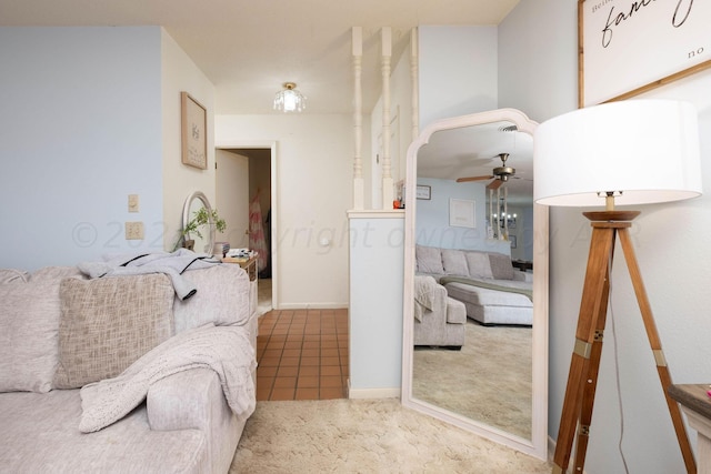 living room featuring ceiling fan and carpet flooring