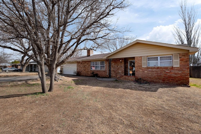 ranch-style home featuring a garage