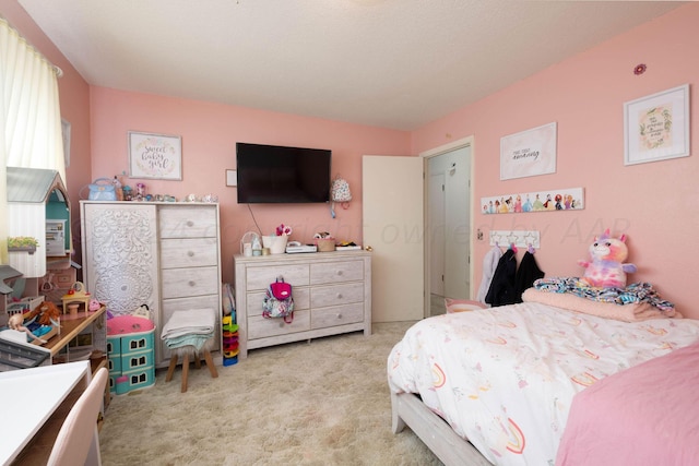 bedroom with light colored carpet