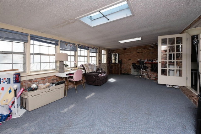 unfurnished sunroom with vaulted ceiling with skylight