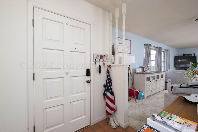 interior space with light tile patterned floors