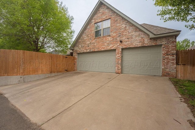 6007 Riley Elizabeth Dr, Amarillo, TX 79119 - garage featuring fence and driveway