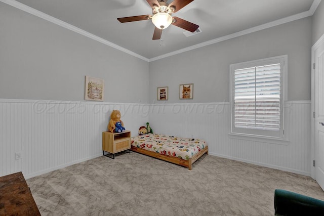 6007 Riley Elizabeth Dr, Amarillo, TX 79119 - bedroom with ceiling fan, carpet floors, a wainscoted wall, visible vents, and ornamental molding