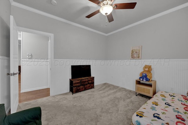 6007 Riley Elizabeth Dr, Amarillo, TX 79119 - bedroom featuring crown molding, ceiling fan, wainscoting, and carpet flooring