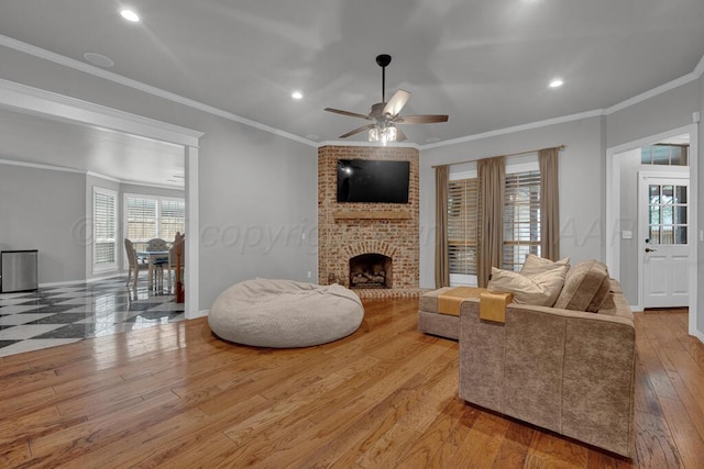 6007 Riley Elizabeth Dr, Amarillo, TX 79119 - living room with a brick fireplace, crown molding, ceiling fan, and a healthy amount of sunlight