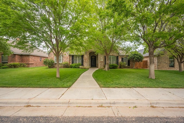 6007 Riley Elizabeth Dr, Amarillo, TX 79119 - view of front of house with brick siding and a front yard