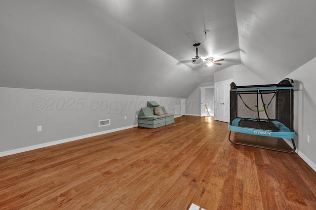 6007 Riley Elizabeth Dr, Amarillo, TX 79119 - additional living space featuring ceiling fan, baseboards, wood finished floors, vaulted ceiling, and visible vents