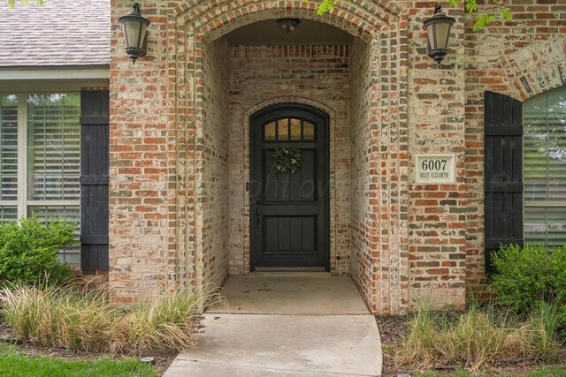 6007 Riley Elizabeth Dr, Amarillo, TX 79119 - doorway to property featuring brick siding