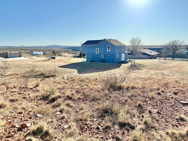 exterior space with a rural view