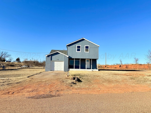 view of front of property with brick siding and an attached garage