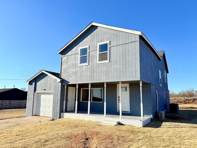 view of front of house featuring central AC unit, concrete driveway, an attached garage, a porch, and brick siding