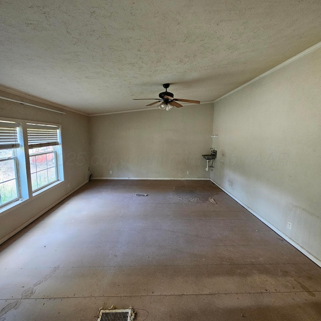 unfurnished room featuring a textured ceiling