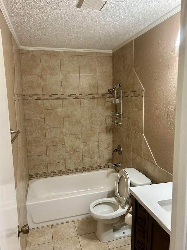 702 Floyd Ave, Dumas, TX 79029 - bathroom featuring a textured ceiling, crown molding, toilet, tile patterned flooring, and vanity