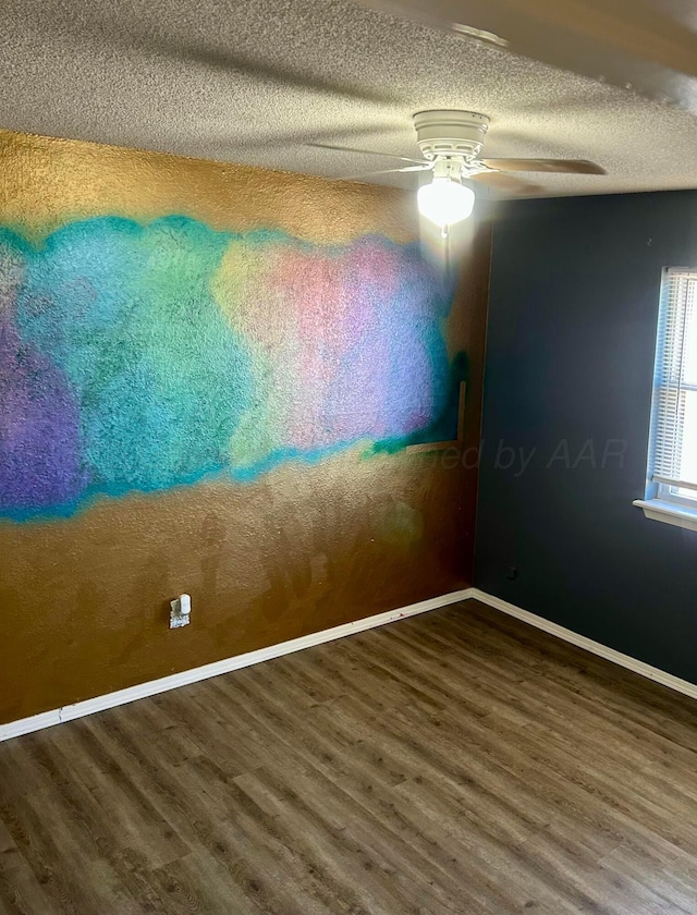 702 Floyd Ave, Dumas, TX 79029 - spare room featuring wood finished floors, a textured ceiling, baseboards, and a ceiling fan