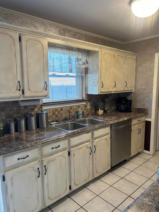 702 Floyd Ave, Dumas, TX 79029 - kitchen with dishwasher, a sink, dark countertops, backsplash, and ornamental molding
