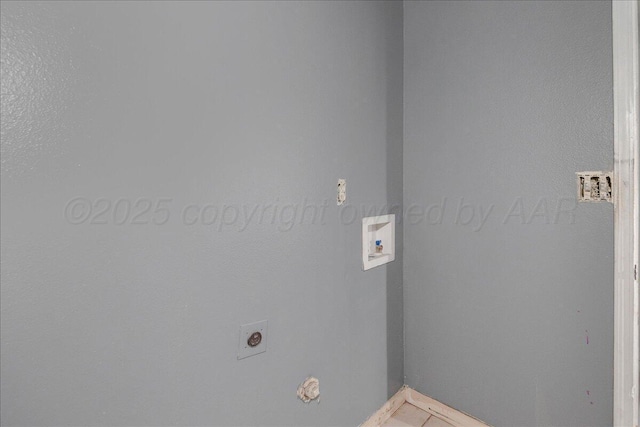 507 N Taylor St, Amarillo, TX 79107 - laundry area with electric dryer hookup, hookup for a washing machine, and light tile patterned floors