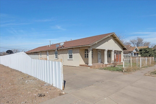 507 N Taylor St, Amarillo, TX 79107 - view of front of property with stucco siding and covered porch