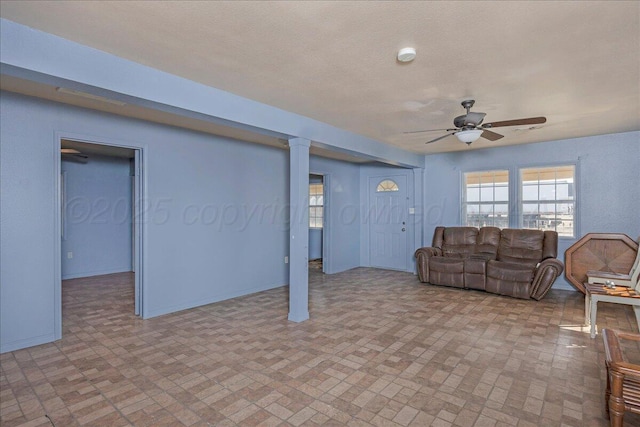 507 N Taylor St, Amarillo, TX 79107 - living area featuring brick patterned flooring, a ceiling fan, and decorative columns