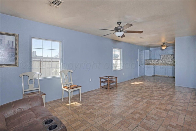 507 N Taylor St, Amarillo, TX 79107 - living room with ceiling fan and brick patterned floors
