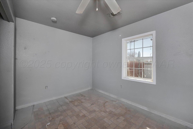 507 N Taylor St, Amarillo, TX 79107 - unfurnished room featuring a smoke detector, a ceiling fan, and brick patterned flooring