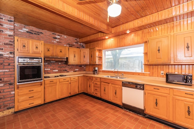 1600 S Hughes St, Amarillo, TX 79102 - kitchen with black appliances, a sink, wood ceiling, light countertops, and brick patterned flooring