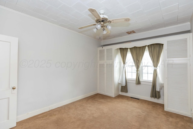 1600 S Hughes St, Amarillo, TX 79102 - spare room with light colored carpet, ornamental molding, ceiling fan, and baseboards