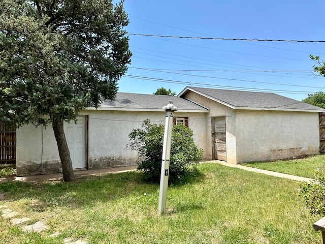1600 S Hughes St, Amarillo, TX 79102 - view of home's exterior featuring stucco siding and a shingled roof