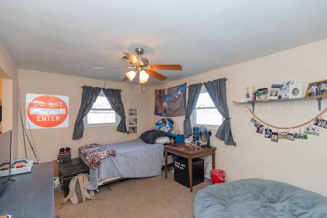 bedroom with carpet floors, multiple windows, and ceiling fan