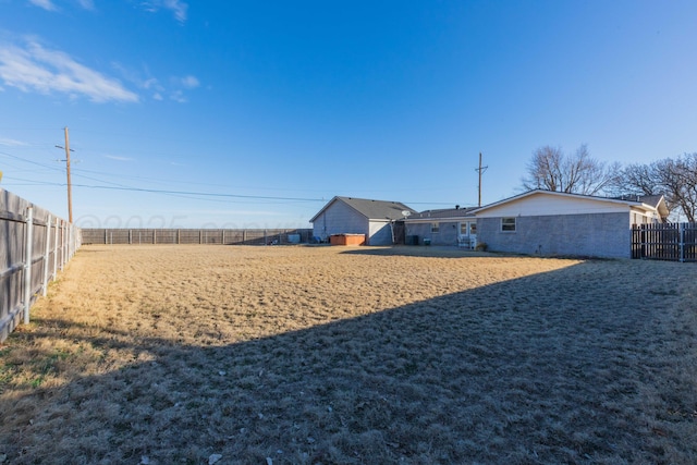 view of yard with a fenced backyard