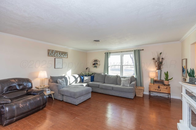 living area with a textured ceiling, ornamental molding, wood finished floors, and baseboards