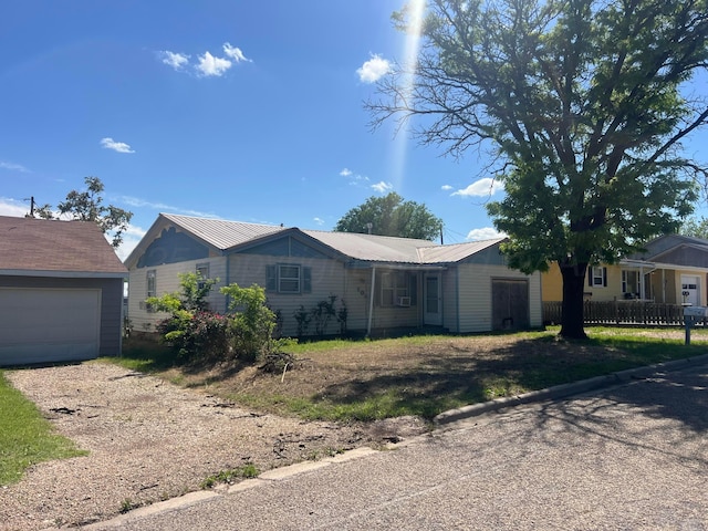 104 Peiffer St, Borger, TX 79007 - single story home featuring metal roof, a garage, and dirt driveway