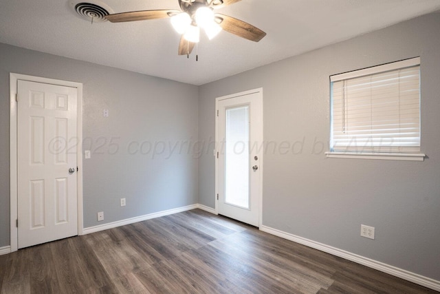 1301 Clyde St, Amarillo, TX 79106 - spare room with dark wood finished floors and ceiling fan