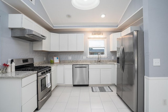 1301 Clyde St, Amarillo, TX 79106 - kitchen featuring stainless steel appliances, exhaust hood, white cabinets, light stone counters, and a tray ceiling