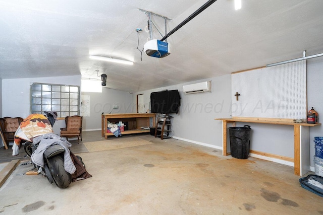 1301 Clyde St, Amarillo, TX 79106 - garage with a workshop area, an AC wall unit, and a garage door opener