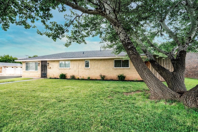 1301 Clyde St, Amarillo, TX 79106 - view of front facade with brick siding and a front lawn