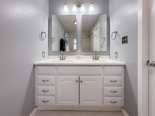 1301 Clyde St, Amarillo, TX 79106 - full bathroom with double vanity, a textured wall, and a shower with shower curtain