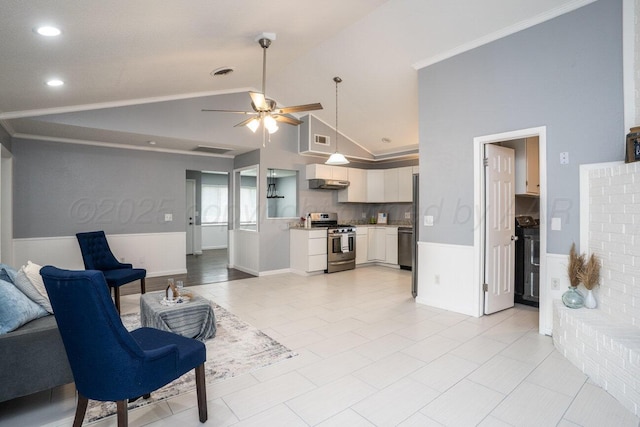 1301 Clyde St, Amarillo, TX 79106 - living area featuring a wainscoted wall, ceiling fan, lofted ceiling, and recessed lighting