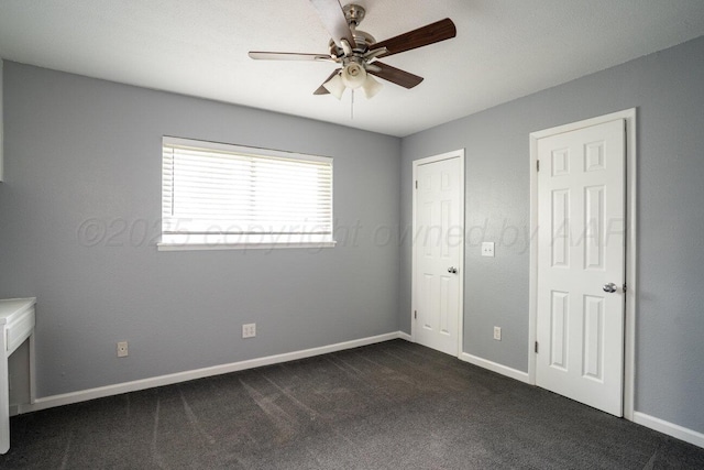 1301 Clyde St, Amarillo, TX 79106 - unfurnished bedroom with dark colored carpet and ceiling fan
